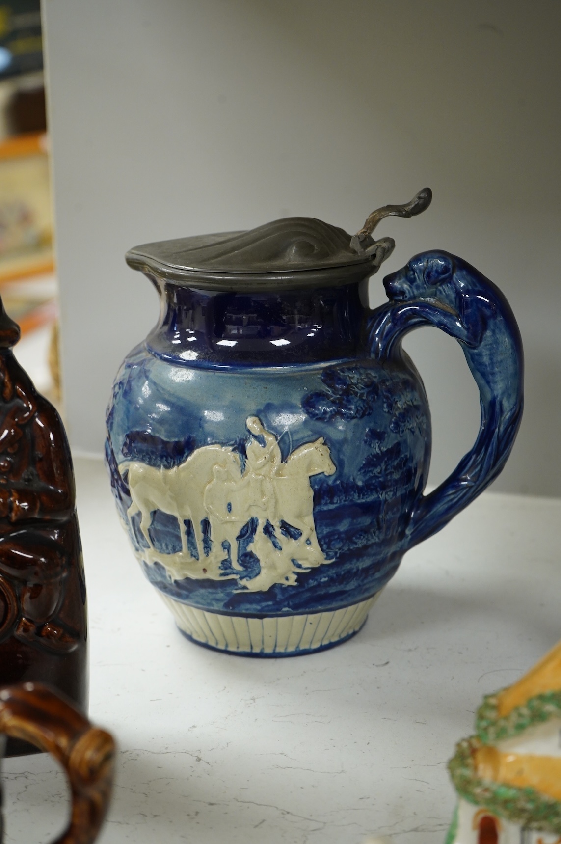 A group of various Victorian Staffordshire pottery models of cottages and various figure moulded vessels together with an Italian maiolica ewer, tallest 25cm